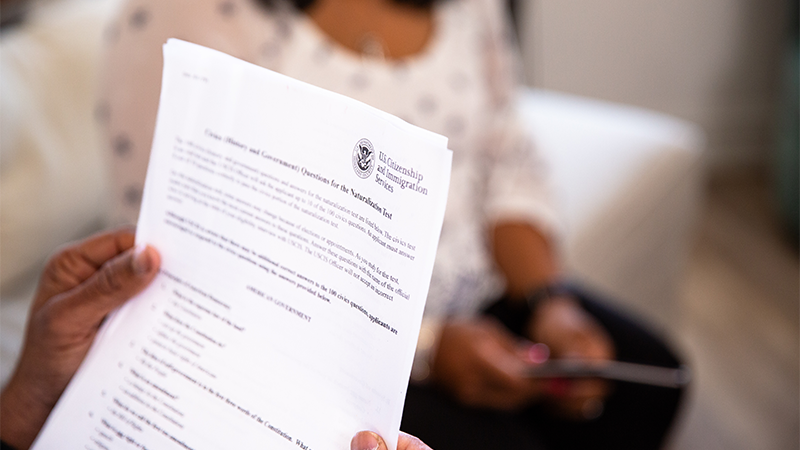Hands holding a document