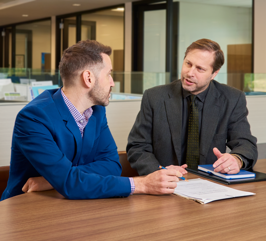 Aaron Bottge, SBA Lending Attorney, working with a client at Jellum Law