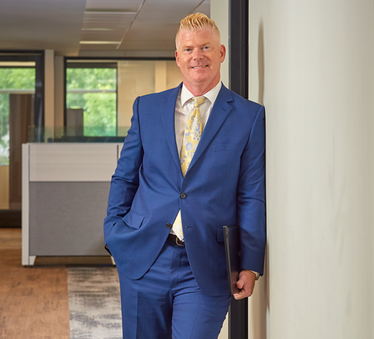 Garth Gavenda | Commercial Litigation Attorney at Jellum Law standing in the office